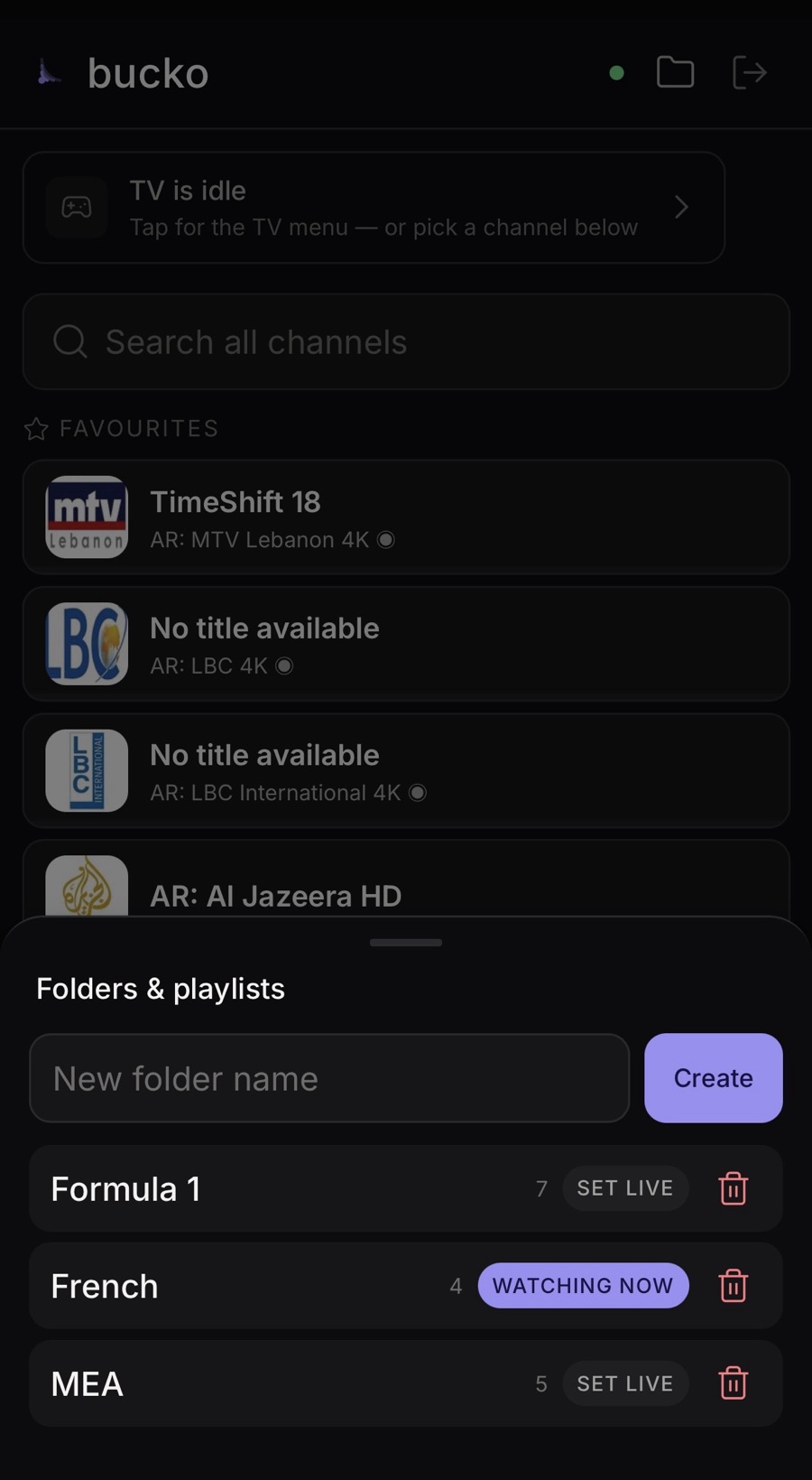 The folders and playlists sheet: create a folder, set one live, delete, over the favourites list.
